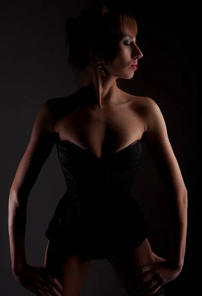 Lingerie model over dark background — Stock Photo, Image