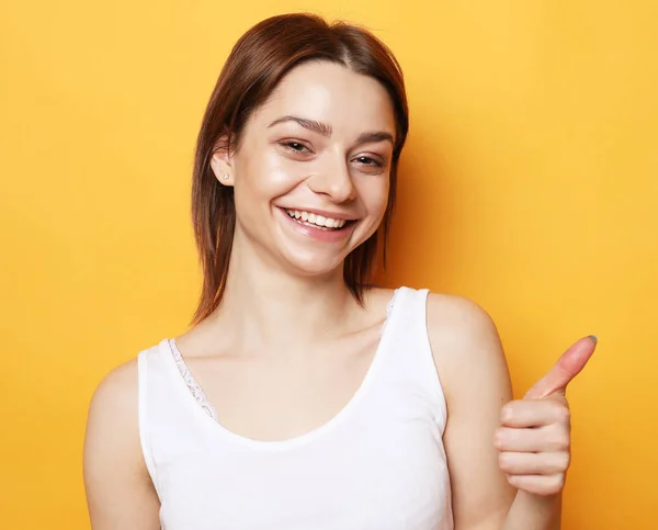 Portrait of young  positive female with cheerful expression