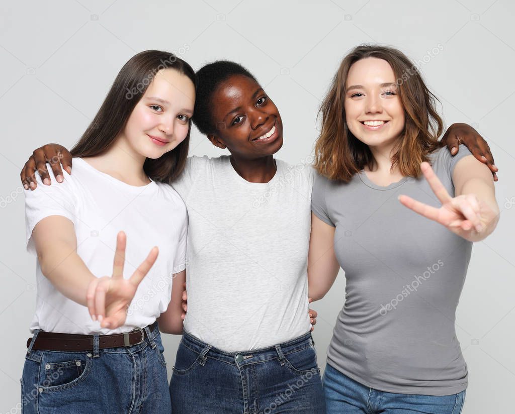   Cheerful European, Asian and African womens.