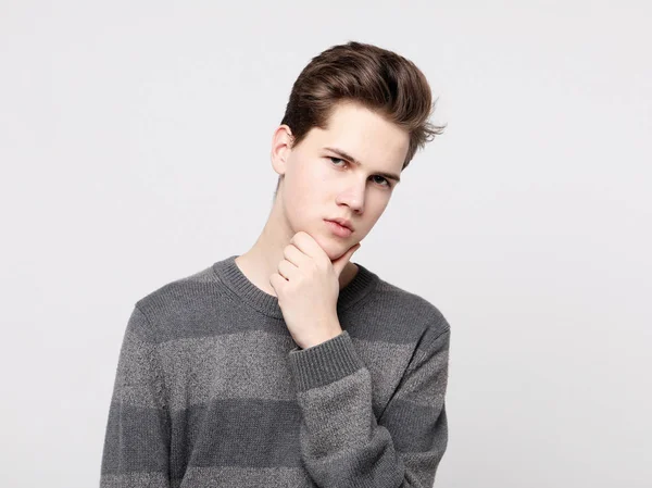 Attractive teenage boy posing in studio — Stock Photo, Image