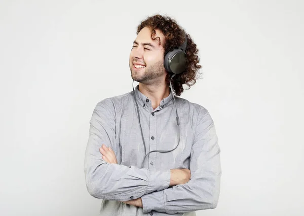 Enjoying the sound of music. Studio portrait of handsome young man with  headphones.