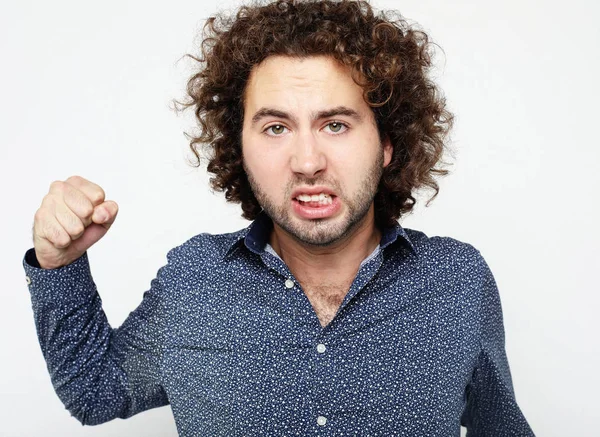 Caucasian angry man on gray background — Stock Photo, Image