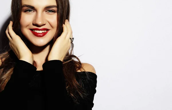 Young beautiful woman wearing black dress posing over white back — Stock Photo, Image