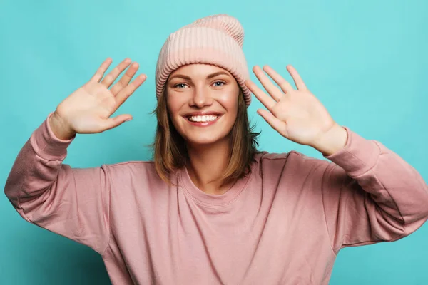 Image of happy young lady wearing pink hat and sweater — Stock Photo, Image