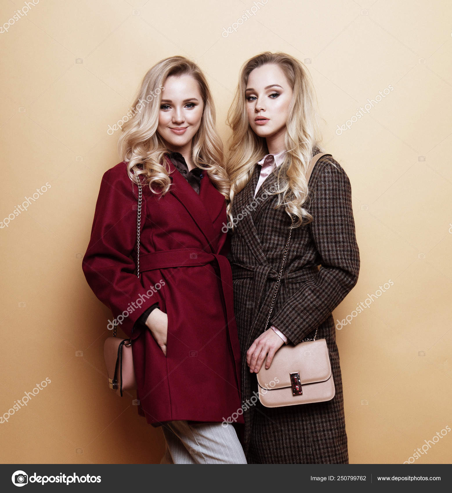 Two Beautiful Women Posing Outside Against Wall Background Street Style  Fashion Stock Photos - Free & Royalty-Free Stock Photos from Dreamstime