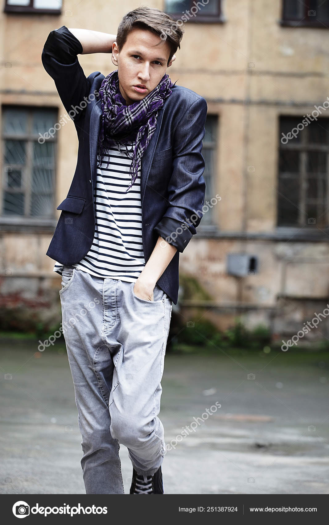 attractive fashion male model dressed elegant - casual posing against wall  Stock Photo | Adobe Stock