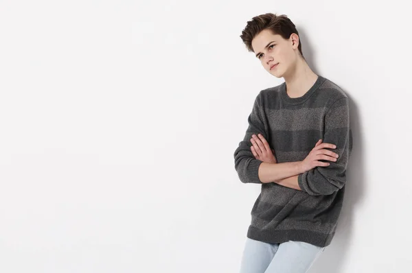 Attractive teenage boy posing in studio — Stock Photo, Image
