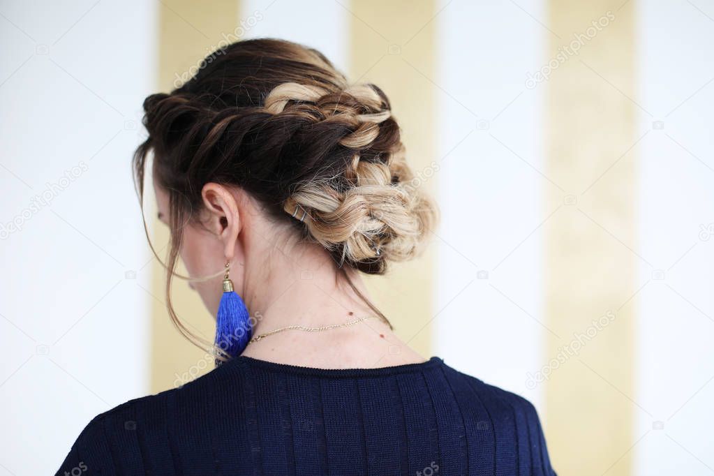 woman with blue earrings, hairstyle back view