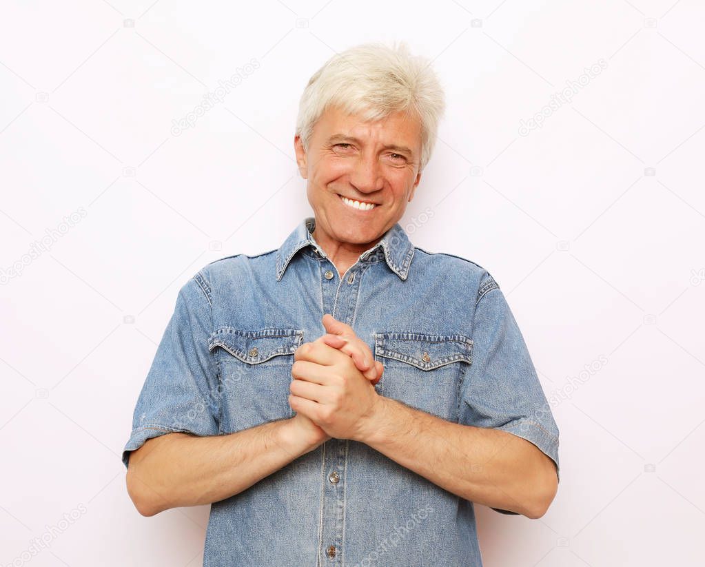 Close up portrait of senior man on white background