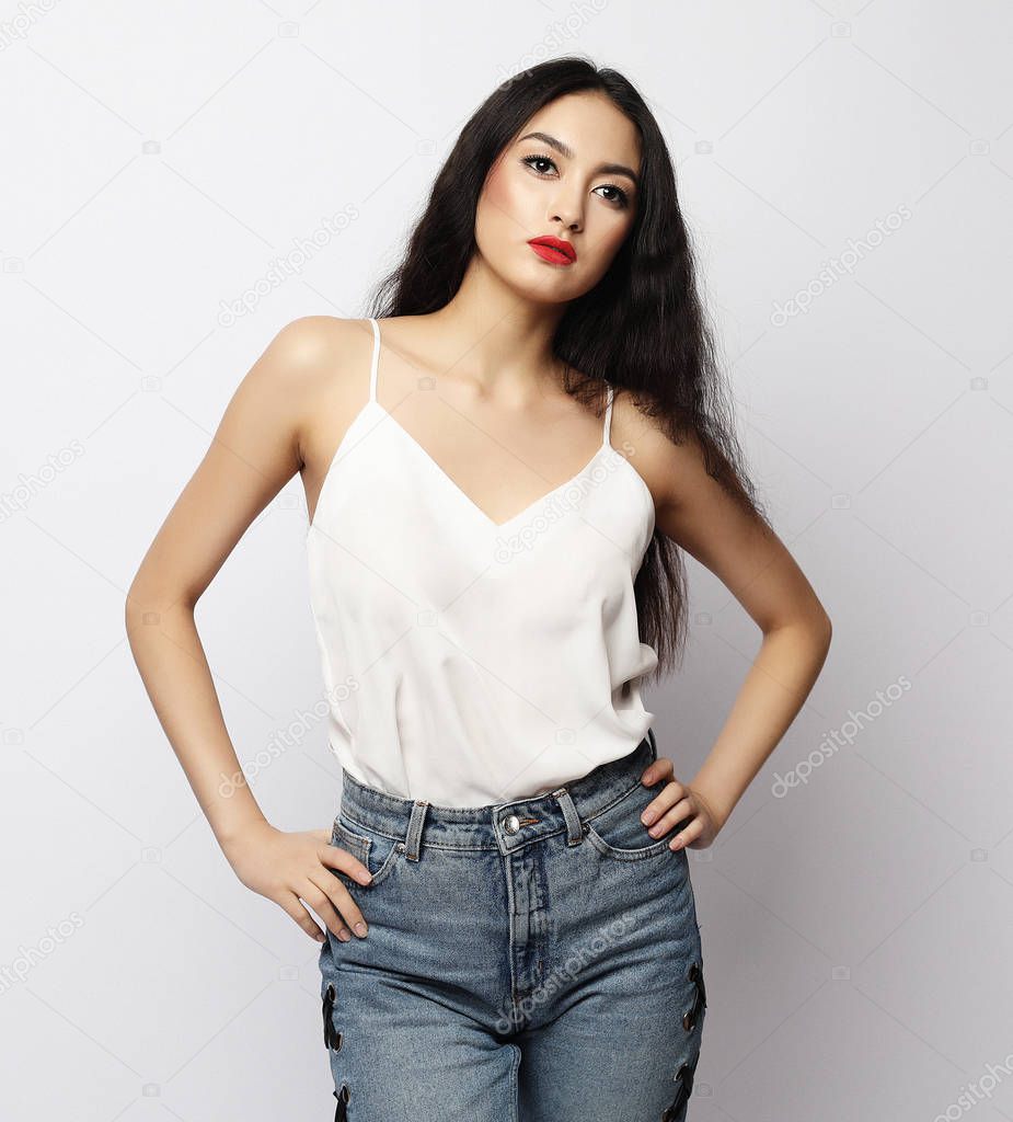lifestyle and people concept - beautiful young asian woman with long hair posing in casual clothes