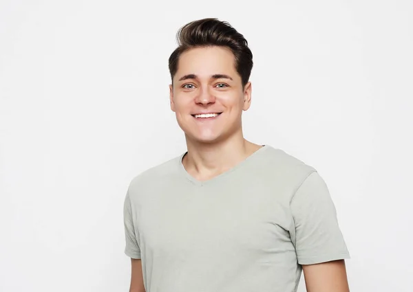 Portrait of a young man surprised face expression over white background — Stock Photo, Image