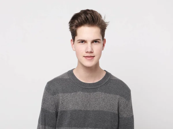 Attractive teenage boy posing in studio — Stock Photo, Image