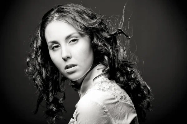 Portrait of pretty young woman with curly hair. — Stock Photo, Image