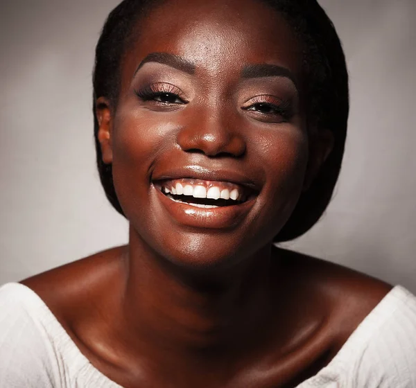 life style and people concept: Close up portrait of confident african american woman laughing