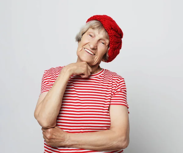 Lifestyle and people concept: funny grandmother posing in studio — Stock Photo, Image