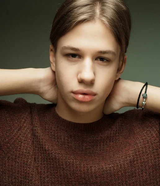 Attractive teenage boy posing in studio — Stock Photo, Image