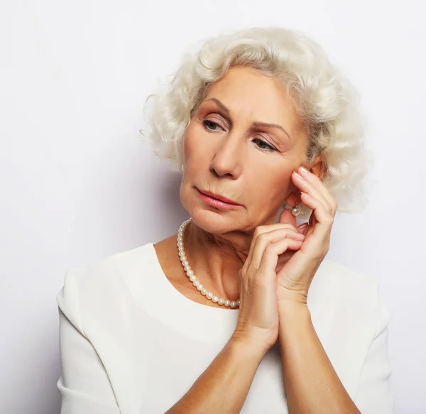 Thoughtful serious senior woman feeling blue worried about problems — Stock Photo, Image