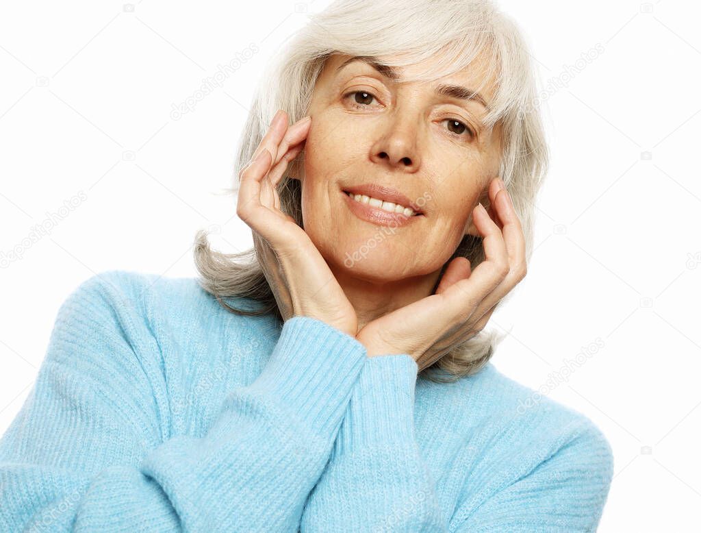 Elderly happy woman wearing blue sweater