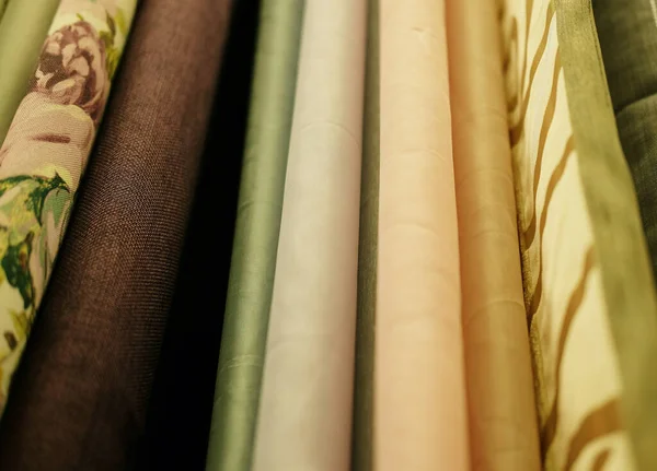 Rolls of fabric and textiles in store