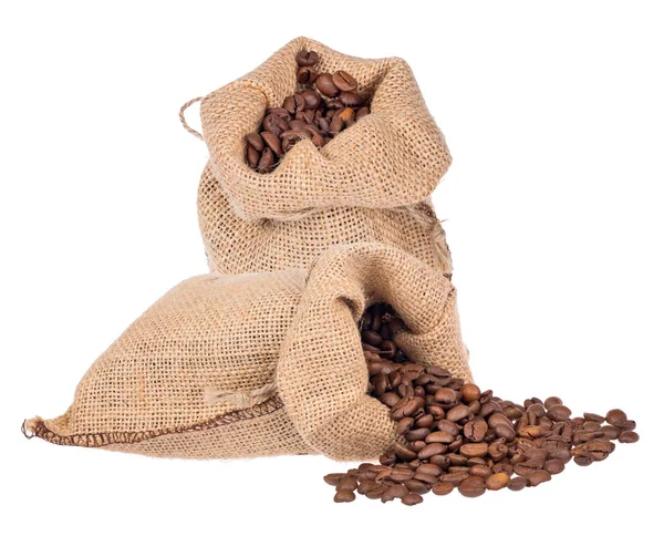 Granos de café marrón en dos sacos de arpillera —  Fotos de Stock