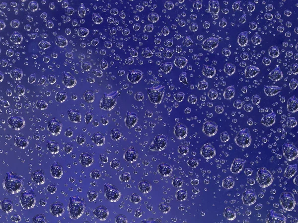 Fundo azul de pequenas gotas — Fotografia de Stock