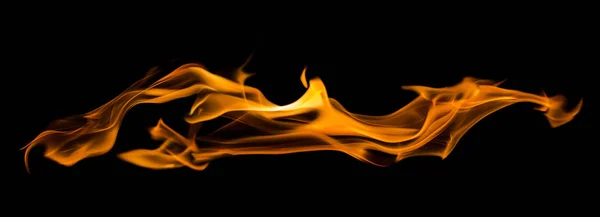 Yellow flame long spark isolated on black — Stock Photo, Image