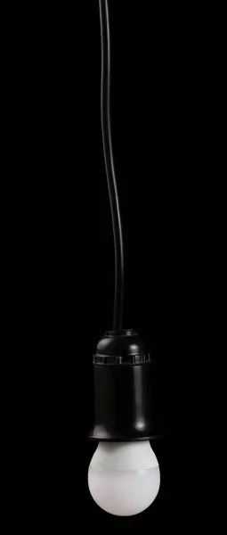 LED-elektrische Lampe in Buchse isoliert auf schwarz — Stockfoto