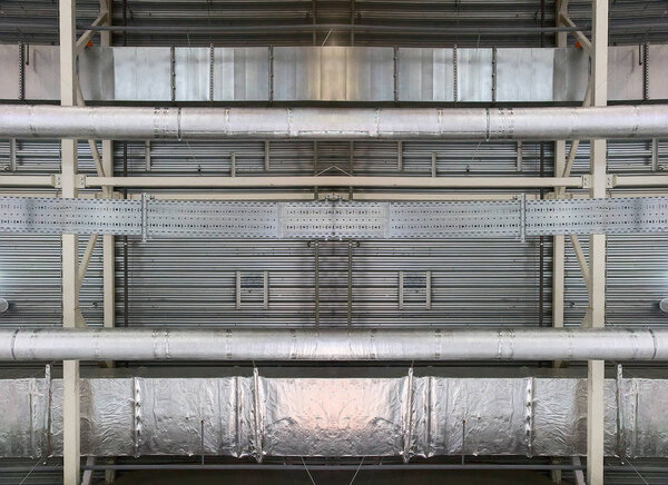 Photo of industrial metallic ceiling with pipes