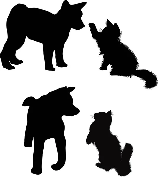 Puppy en kitten silhouetten geïsoleerd op wit — Stockvector