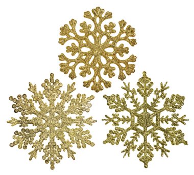 Beyaz arkaplanda izole edilmiş üç altın kar tanesi şekilli dekorasyon