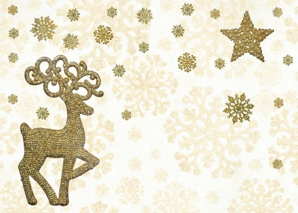 光の背景に雪の結晶の下に金のクリスマス鹿 — ストック写真