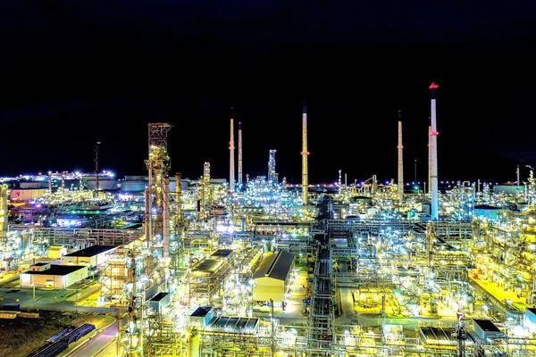 Aerial view. Oil refinery factory and oil storage tank at night