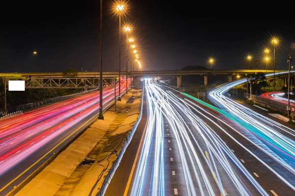 Speed Traffic - light trails on motorway highway at night, long