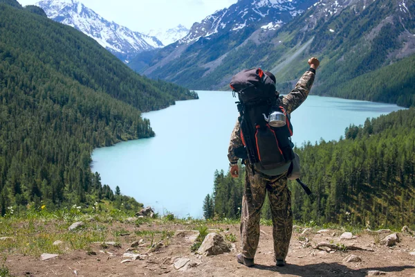 Man Raised Hand Looks Mountain Lake Delight Royalty Free Stock Photos