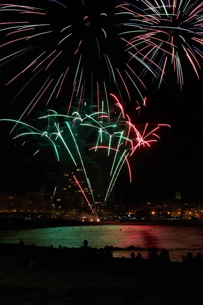 Night fireworks in a small town in Palamos in Spanish Costa Brava