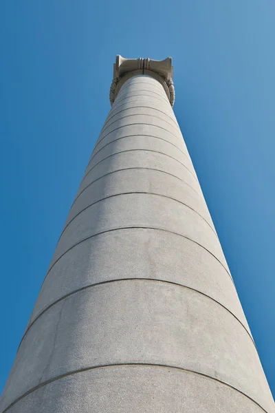 Big, strong stone columns on the street in Barcelona in Spain from bottom view, hill Montjuic. — Stock Photo, Image