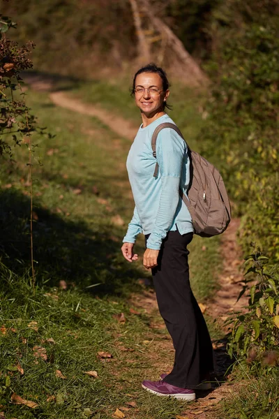 Pretty spanish woman on the path in the forest — Stock Photo, Image