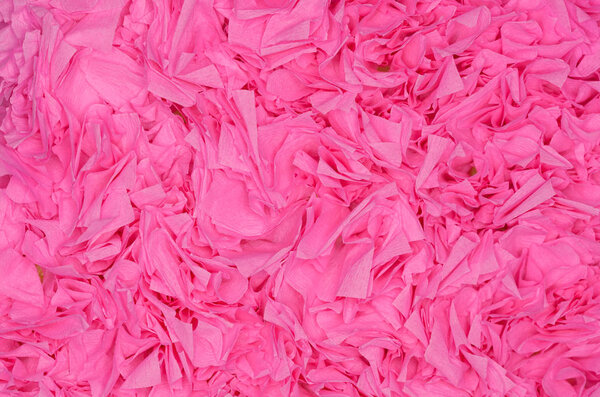 Background of pink paper flower close-up.