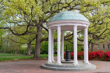 Flowers Bloom in Spring at the Old Well Rotunda at University of North Carolina in Chapel Hill clipart