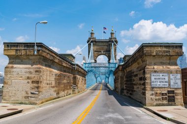 CINCINNATI, OH - JUNE 18, 2018: The historic John A. Roebling Suspension Bridge in Cincinnati, Ohio clipart
