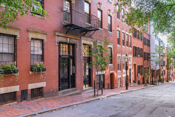 Boston, MA - September 30, 2018: Historic brick townhomes along Revere Street in downtown Boston