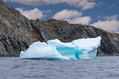 Iceberg floating in the ocean  clipart