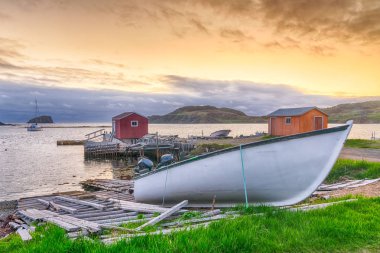 Sunset in fishing village in Newfoundland, Canada clipart