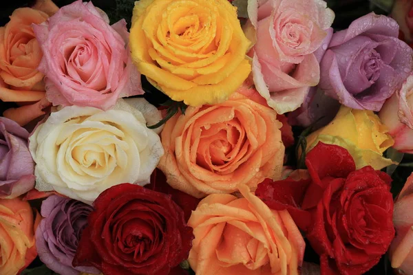 Multicolored roses in a floral wedding decoration