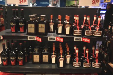Beverwijk, the Netherlands, december 15th, 2018: Bottles in liquor store clipart