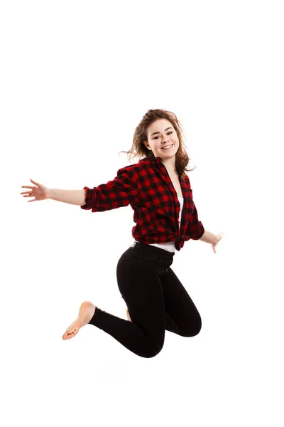 Chica Jeans Negros Camisa Cuadros Saltando Aislado Sobre Fondo Blanco — Foto de Stock