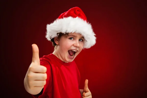 Boy Santa Hat Showing Thumbs Gradient Red Black Background — Stock Photo, Image