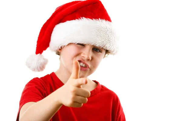 滑稽的男孩在圣诞老人帽子显示拇指在白色背景被隔绝了 — 图库照片