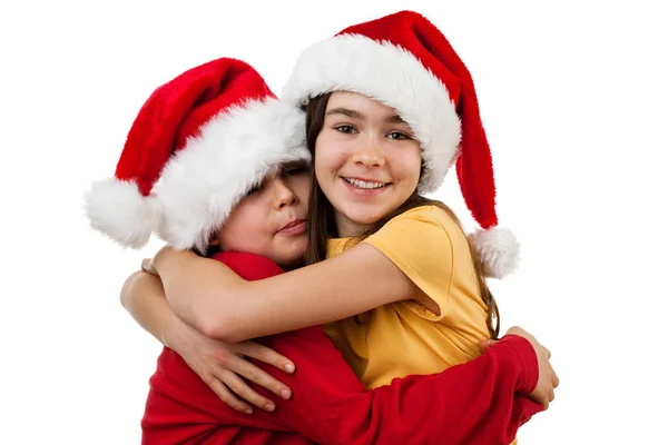 Dzieci Santa Kapelusze Przytulanie Białym Tle — Zdjęcie stockowe