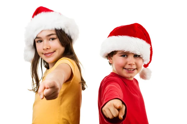 Menino e menina em chapéus de Papai Noel — Fotografia de Stock